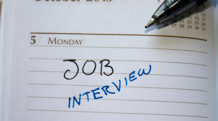 A calendar that shows a job interview marked as a date on a Monday.