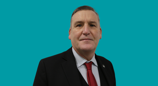 One of Berneslai Homes' Board members, Cllr Kevin Osborne, superimposed on a light blue background.