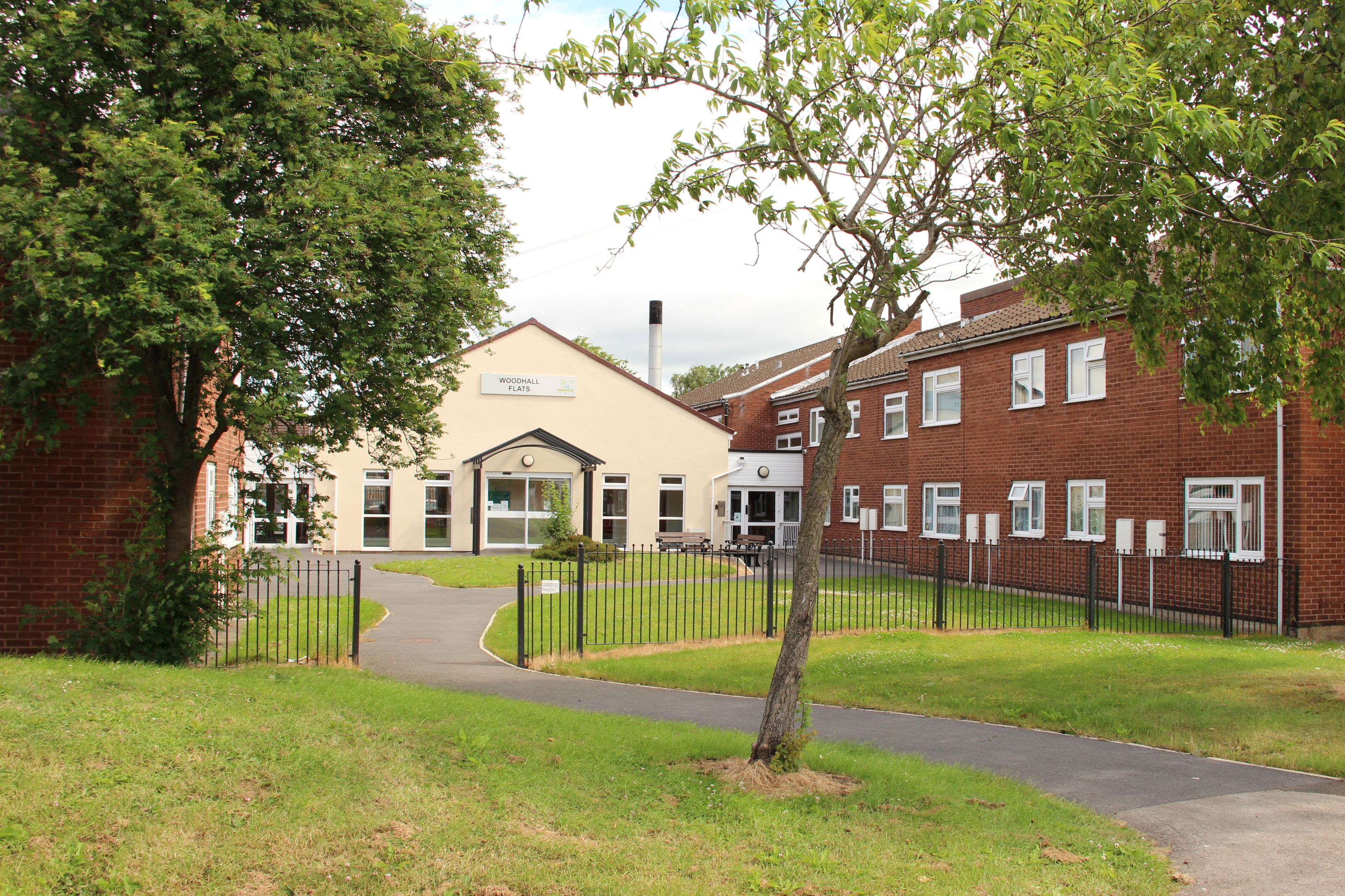 A path leading to the entrance to Woodhall Flats.
