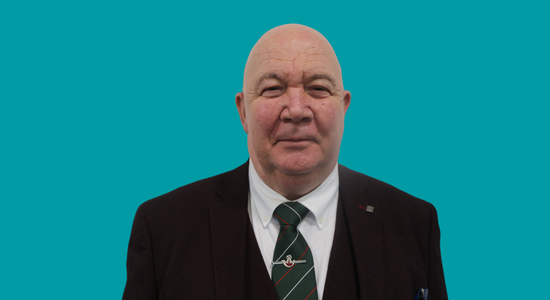 One of Berneslai Homes' Board members, Cllr Dave Leech, superimposed on a light blue background.