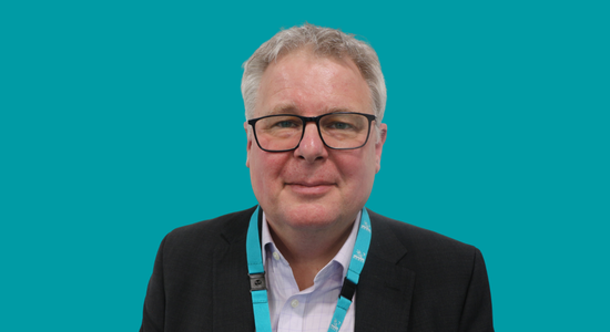 One of Berneslai Homes' Board members, Richard Fryer, superimposed on a light blue background.